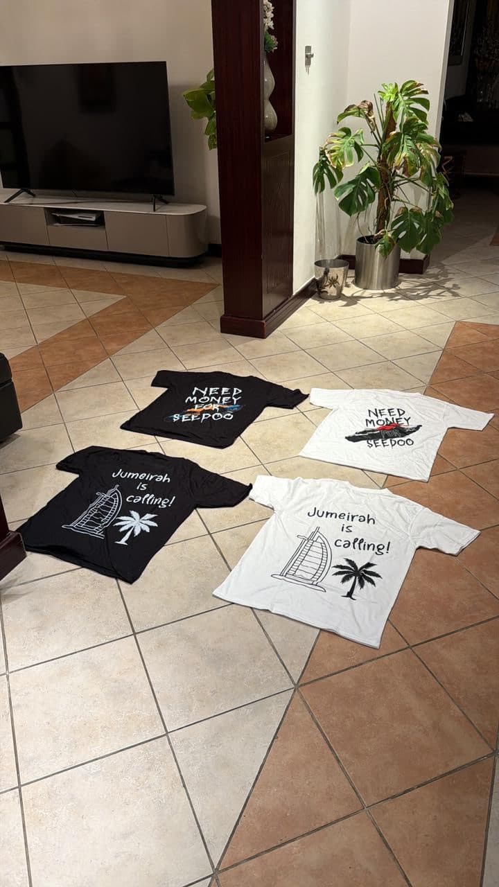 Four RS Supply tees laid out on a tiled floor, both graphics in both colourways